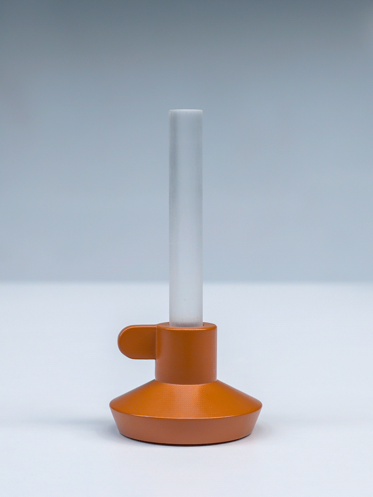Stop motion animation of the orange candle light turning on and off as you press the top.