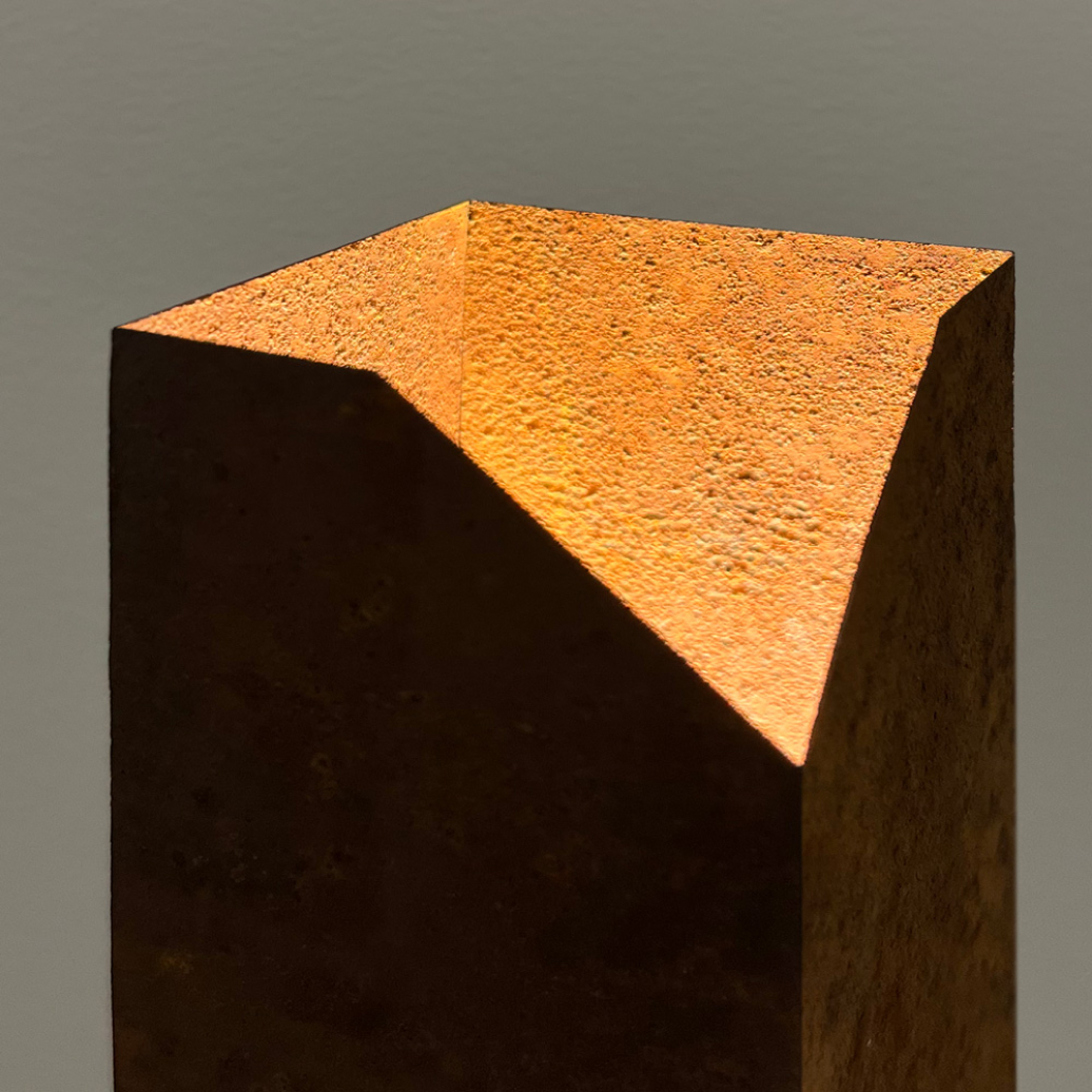 Photograph of the top of the Rust light showing the glow of illuminated rusted steel.