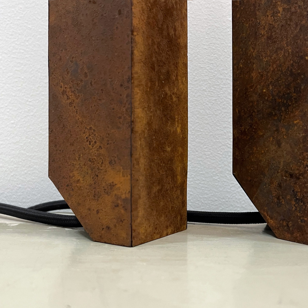 Photograph of the bottom of the Rust light showing the notch with electrical cord position.